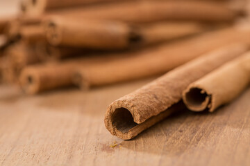 cinnamon sticks on wooden table.