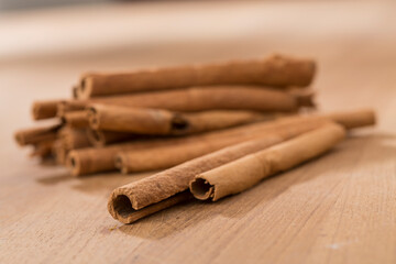cinnamon sticks on wooden table.