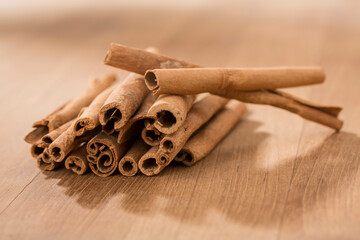 cinnamon sticks on wooden table.