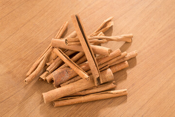 cinnamon sticks on wooden table.
