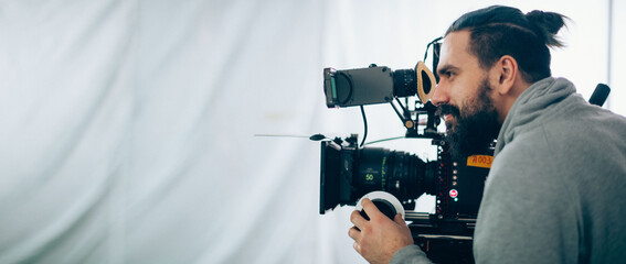 Director of photography with a camera in his hands on the set.