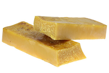 pure beeswax ingot isolated on white background