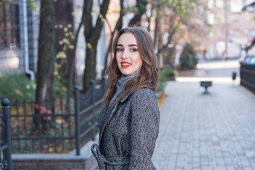 Portrait of a beautiful and happy girl outdoors. Beauty and fashion