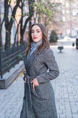 Fototapeta premium Portrait of a beautiful and happy girl outdoors. Beauty and fashion