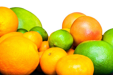 Isolated vibrant citruses on white background. Oranges, tangerines, limes, pummelo, grapefruits.