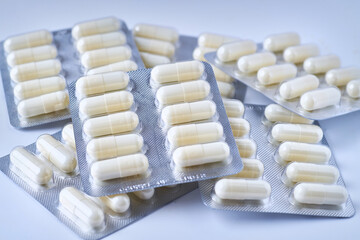 Fototapeta na wymiar Pile of tablets in blister packaging. Pharmaceutical industry.