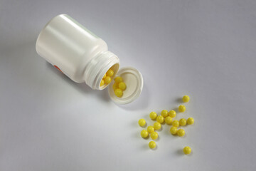 vitamin c in the form of round yellow tablets