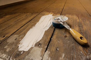 DIY, applying putty over a fatigue old wooden floor, Refurbishing floor.