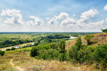 Obraz premium View of the river, forests and fields. Landscape in Russia