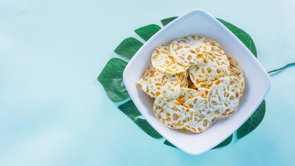 Keripik tempe is a traditional snack in Indonesia isolated on bright background