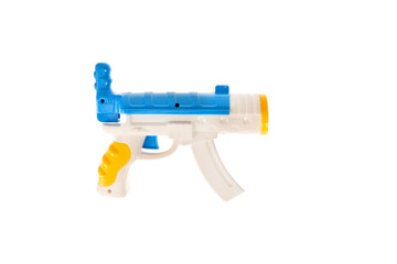 A toy gun. Plastic children's toy gun for shooting balls. Toy weapons.