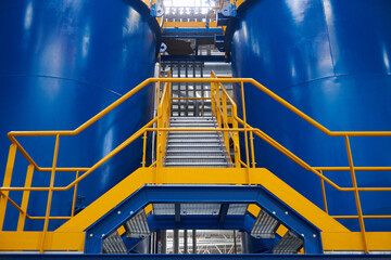 Stairs between oil tanks