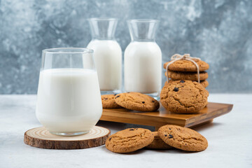 A glass and jar of milk with delicious cookies