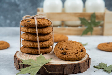 Chocolate cookies in rope on a wooden board