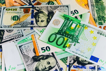 Paper banknotes of Euro 50 and 100. Cash close-up, color background of money view from above...