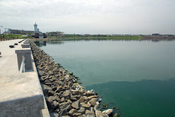 Boyukshor Lake in Baku Azerbaijan . According to geological data, the average depth of the water in the lake is 3.40-3.95 meters . An oval bridge from iron and wood on the edge of the lake .