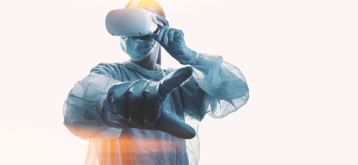woman doctor in a helmet of virtual reality with manipulators in hands on a white background. the concept of conducting remote operations using modern VR technologies