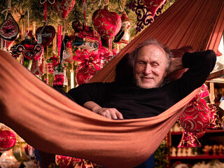 portrait of a person in a hammock for Christmas. 