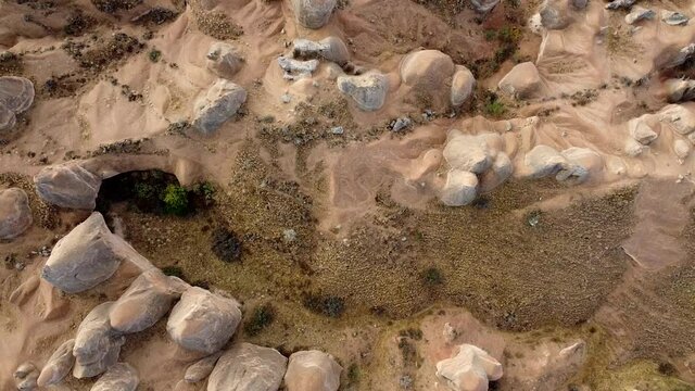 Flight over Fairy Chimneys in Cappadocia. Top down video. Aktepe, Avanos, Nevşehir, Turkey.