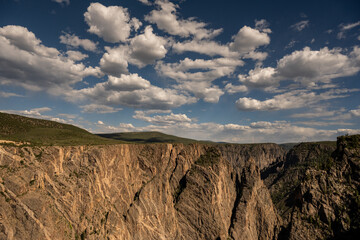 Puffy Clouds Fill The Sky Above Black Canyon