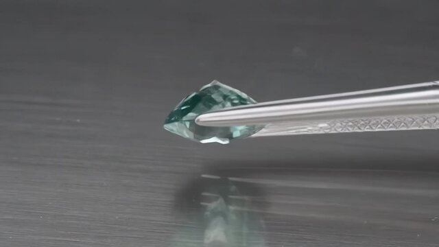 natural blue tourmaline indicolite on the grey background