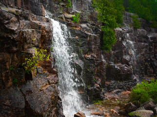 Obraz premium Waterfalls on the Cliff Side