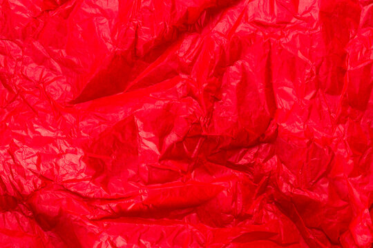 Bright Red Wrapping Paper Crumpled Paper Texture. Creased Sheet Background. Textured Effect.