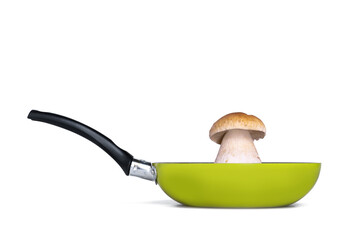 Beautiful thick mushroom - cep (porcini, penny bun, Boletus edulis) riding on the pan (skillet). Side view. Studio isolated photo on white.