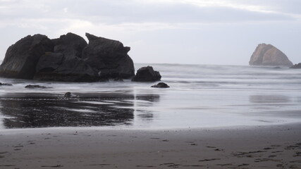 Fototapeta na wymiar Rocks in the ocean with fog