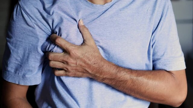 man feel pain on his heart chest pain, heart attack, health care concept.