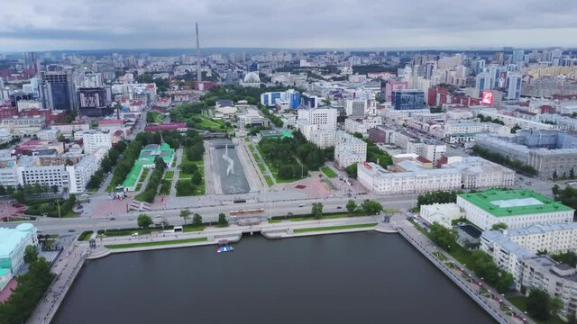 Aerial of modern office buildings and residential houses. Stock footage. Drone view of contemporary residential district, concept of urbanization. 