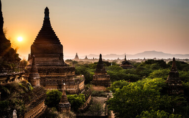 sunset behind a temple in bagan