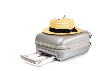 Summer concept background. Travel accessories with suitcase, straw hat, toy airplane in minimal trip vacation concept isolated on white. Copy space, summer vacation and business travel concept.