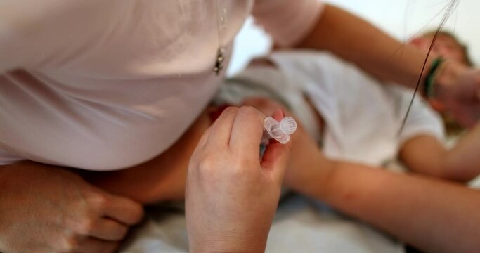 Vaccinating baby toddler. Parent holding infant for vaccination