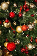 Christmas decorations on the Christmas tree, snowflakes balls garlands, closeup texture background