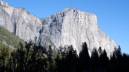 El Capitan Mountain landscape with sky, trees and clouds