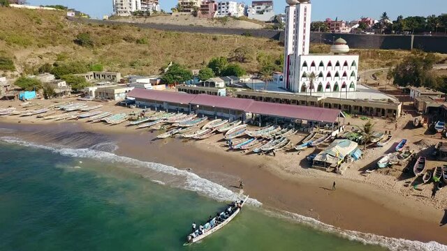 Overview Of Small Fishing Village And Its Divinity Mosque On The Coast Of Dakar, Senegal, Africa - 
aerial drone shot