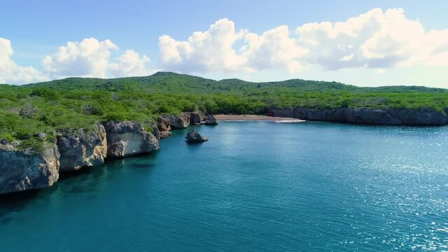 Drone shot of the coast at the black sand beach in Curacao
