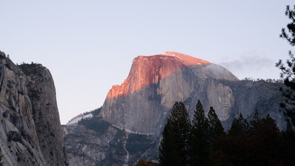 Half dome mountain with sunlights and clouds