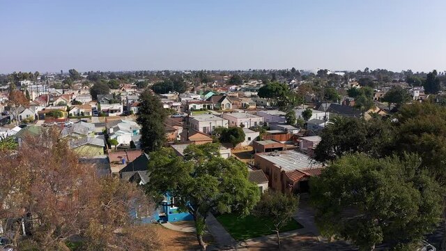 Aerial rising and panning shot of a South LA neighborhood. HD at 60 FPS.