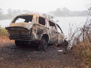 Burned car crashed into bayou