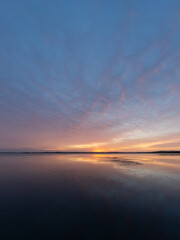 Fototapeta na wymiar Colorful sunrise sky with reflection on the lake.