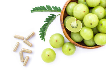 Indian gooseberry fruits ( phyllanthus emblica, amla ) with green leaf isolated on white 