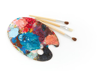 Artist's palette with different colors isolated on a white background