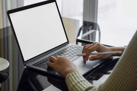 Mockup image of business woman  hands typing on laptop computer keyboard at workplace.