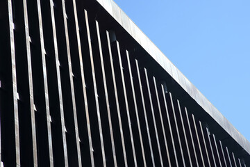 transparent facade of the building against the sky