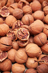 Pile of walnuts background on table