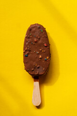 chocolate ice cream on the yellow background