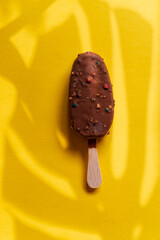 chocolate ice cream on the yellow background