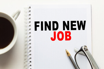 Notepad with inscriptions FIND NEW JOB on a white background. business concept.